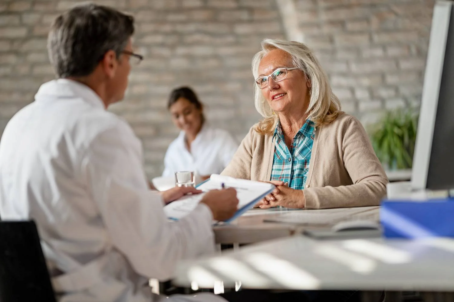 A doctor talking with a patient